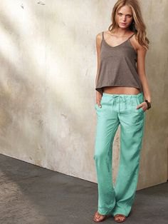 forest green vest top with low waist linen trousers