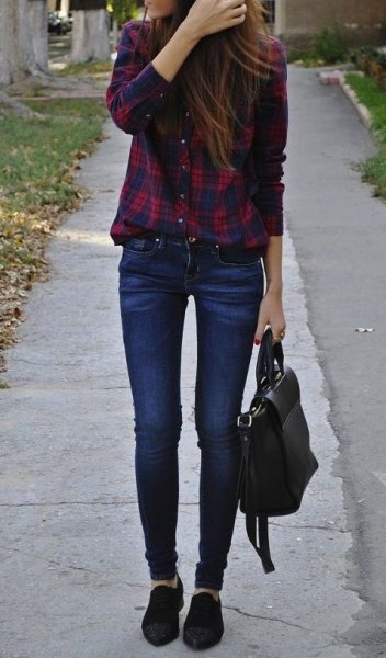 tucked in skinny jeans in flannel plaid shirt