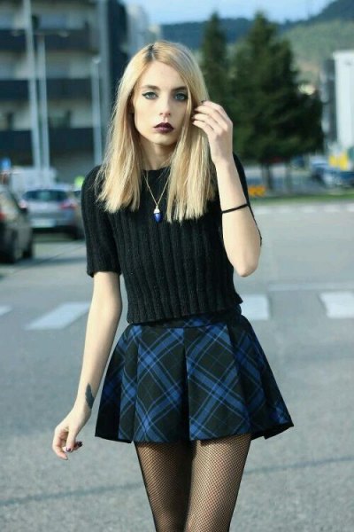 black knitted sweater with plaid mini flare skirt