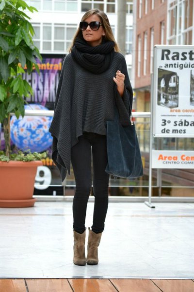 gray poncho sweater with black knitted scarf