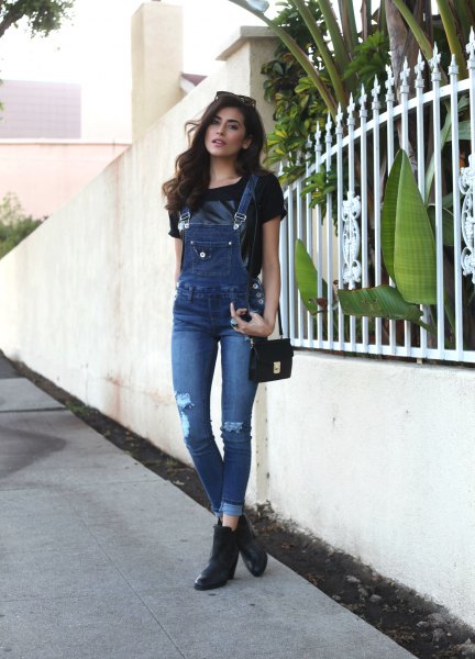 black t-shirt with ripped denim skinny overalls