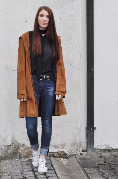 brown suede with black choker neck blouse and cuffed jeans