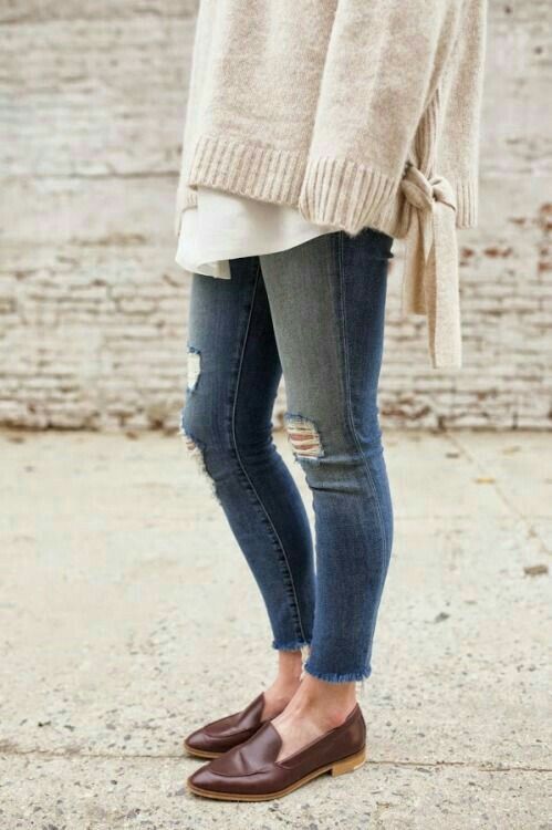 Fall style. Sweater over tunic with distressed jeans and loafers .