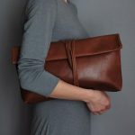 Gray dress + brown leather purse. clothing women apparel .