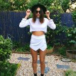 OUTFIT: cropped white jumper, white skort, black shoes and .