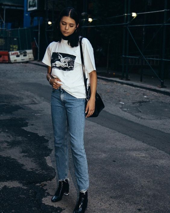 Layer a turtleneck under a graphic t-shirt and jeans for a cool .