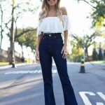 Off the shoulder lace top + high-waisted bell bottom jeans. | 70 .