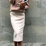 Salmon pink cable knit sweater with khaki pencil skirt and white .
