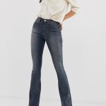 ASOS DESIGN Tall super low rise flare jeans in dark stone wash .