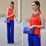 cobalt pants outfit with orange top and cobalt clutch | Colourful .