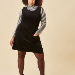 Delightful Daphne! This classic black pinafore dress is a stylish .