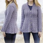 Hand knitted ladies womens cardigan with cables and shawl collar .