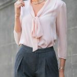 blush pink tie bow neck blouse, high-waisted pleated grey wool .