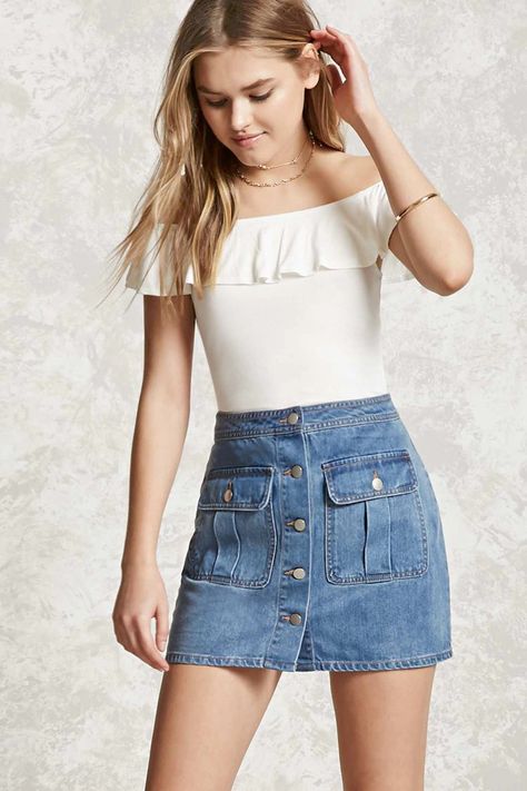 A denim mini skirt featuring a button front, two front button-flap .
