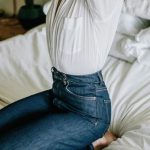 Every day girl outfit, simple white t-shirt tucked into jeans .