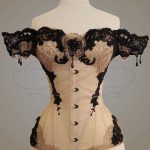 Ornate Victorian style black and white corset, draped lace sleeve .