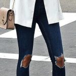winter #outfits white blazer, distressed blue skinny jeans and .